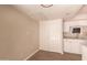 Cozy pantry space with white cabinets, spacious closet, and wood-look flooring at 9460 N 92Nd St # 119, Scottsdale, AZ 85258