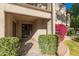 Charming patio with lush landscaping and entry to main living area at 9460 N 92Nd St # 119, Scottsdale, AZ 85258