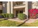 Exterior patio featuring bright flower bush and manicured landscaping at 9460 N 92Nd St # 119, Scottsdale, AZ 85258