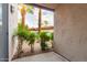 View from covered patio featuring desert landscaping and covered parking area beyond at 9460 N 92Nd St # 119, Scottsdale, AZ 85258