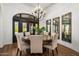 Elegant dining room featuring a chandelier, a round table, comfortable seating, and large windows at 10040 E Happy Valley Rd # 289, Scottsdale, AZ 85255