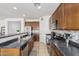 Traditional kitchen featuring stainless steel appliances, ample counter space, and warm wood cabinetry at 10212 W Wier Ave, Tolleson, AZ 85353