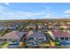 An aerial view of a home featuring a backyard with a pool, putting green, and desert landscaping at 10455 E Thornton Ave, Mesa, AZ 85212