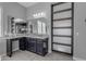 Modern bathroom with granite countertops, dark wood cabinets, and decorative mirrors at 10455 E Thornton Ave, Mesa, AZ 85212