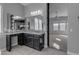 This bathroom vanity features granite counters, dark cabinets, and an adjacent room beyond at 10455 E Thornton Ave, Mesa, AZ 85212