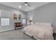 Cozy bedroom features a ceiling fan, natural light, and neutral walls at 10455 E Thornton Ave, Mesa, AZ 85212