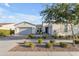 Charming single-story home with a three-car garage, well maintained landscaping, and a manicured front yard at 10455 E Thornton Ave, Mesa, AZ 85212