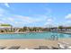 Large outdoor community pool with lounge chairs and umbrellas at 10455 E Thornton Ave, Mesa, AZ 85212