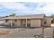 Back of the property featuring a patio, gravel landscaping, and desert plants at 10620 W Snead Dr, Sun City, AZ 85351