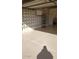 View of an organized garage with a stylish cinder block wall at 10620 W Snead Dr, Sun City, AZ 85351