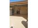 Clean garage with beige painted floor and off-white cinder block wall at 10620 W Snead Dr, Sun City, AZ 85351