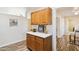 Kitchen cabinet and countertop view, with decorative objects on the white countertop at 10620 W Snead Dr, Sun City, AZ 85351