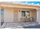 Covered patio with seating area, ideal for enjoying the outdoors at 10620 W Snead Dr, Sun City, AZ 85351