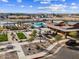 Aerial image showcasing community amenities with a playground, bocce ball court, pool and desert landscaping at 116 N 176Th Ln, Goodyear, AZ 85338