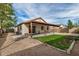 Expansive backyard featuring a covered patio and well-maintained landscaping at 1165 W 4Th Ave, Apache Junction, AZ 85120