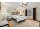 Comfortable bedroom with wooden floors, ceiling fan, and neutral decor at 1165 W 4Th Ave, Apache Junction, AZ 85120