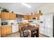 Spacious kitchen with laminate countertops, light cabinets, and tile flooring at 1165 W 4Th Ave, Apache Junction, AZ 85120