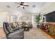 Comfortable living room features a ceiling fan, natural lighting, and modern décor at 1165 W 4Th Ave, Apache Junction, AZ 85120