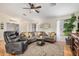 Living area with modern furniture, ceiling fan, and ample space at 1165 W 4Th Ave, Apache Junction, AZ 85120