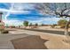 Street view of a well-maintained neighborhood with desert landscaping at 1165 W 4Th Ave, Apache Junction, AZ 85120