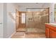 Modern bathroom featuring a glass shower enclosure and tile accents at 119 W Leatherwood Ave, San Tan Valley, AZ 85140