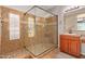 Bathroom featuring a glass shower enclosure and a vanity with a sink at 119 W Leatherwood Ave, San Tan Valley, AZ 85140