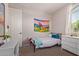 Bedroom with a bed, dresser and a window with natural light at 119 W Leatherwood Ave, San Tan Valley, AZ 85140