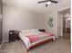 Bedroom featuring carpet, a ceiling fan, a queen-size bed, and modern decor at 119 W Leatherwood Ave, San Tan Valley, AZ 85140