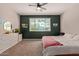 Bedroom with a large window, dresser, and a ceiling fan at 119 W Leatherwood Ave, San Tan Valley, AZ 85140