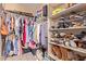 Walk-in closet with ample storage space for clothing and shoes at 119 W Leatherwood Ave, San Tan Valley, AZ 85140