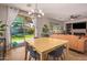 Bright dining area featuring sliding glass doors that fill the space with natural light and backyard views at 119 W Leatherwood Ave, San Tan Valley, AZ 85140