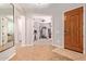 Open entryway featuring tile flooring and a view into a room with a home gym at 119 W Leatherwood Ave, San Tan Valley, AZ 85140