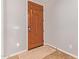 Stylish entryway with a wood door, patterned rug, and neutral wall color at 119 W Leatherwood Ave, San Tan Valley, AZ 85140