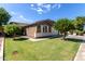 Charming single-story home with a well-manicured lawn and appealing curb appeal on a sunny day at 119 W Leatherwood Ave, San Tan Valley, AZ 85140