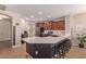 Modern kitchen featuring a center island with bar seating and stainless steel appliances at 119 W Leatherwood Ave, San Tan Valley, AZ 85140