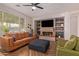 Cozy living room featuring a modern fireplace, stylish decor, and comfortable seating at 119 W Leatherwood Ave, San Tan Valley, AZ 85140