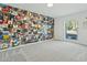 Eclectic bedroom featuring a wall covered in album covers and natural light at 11942 N 95Th St, Scottsdale, AZ 85260