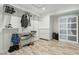 Well-organized walk-in closet with shelving, hanging racks, and a sliding-door cabinet at 11942 N 95Th St, Scottsdale, AZ 85260