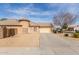 Attractive single-Gathering home with desert landscaping, a tile roof, and a large driveway with an attached garage at 12312 N 147Th Ln, Surprise, AZ 85379