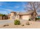 Inviting single-Gathering home featuring desert landscaping, a turret, and a well-maintained facade at 12312 N 147Th Ln, Surprise, AZ 85379