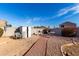 Spacious backyard with shed, seating area, hardscape, and well-maintained gravel at 12809 W Evans Dr, El Mirage, AZ 85335