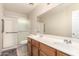 Bright bathroom with double sink vanity and shower with grab bars for accessibility at 12809 W Evans Dr, El Mirage, AZ 85335