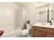 Cozy bathroom featuring a shower-tub combo and a single vanity sink at 12809 W Evans Dr, El Mirage, AZ 85335