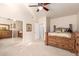 Bedroom with a large mirror, view to bed and ceiling fan at 12809 W Evans Dr, El Mirage, AZ 85335