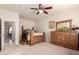 Bedroom with light walls, a ceiling fan, and an open doorway at 12809 W Evans Dr, El Mirage, AZ 85335