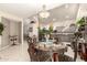 Elegant dining area showcasing a chandelier and formal dining set next to the modern kitchen at 12809 W Evans Dr, El Mirage, AZ 85335