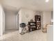 Hallway featuring tile flooring, a bookcase, and access to other rooms at 12809 W Evans Dr, El Mirage, AZ 85335