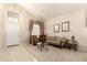 Inviting living room featuring high ceilings, neutral decor, and plenty of natural light at 12809 W Evans Dr, El Mirage, AZ 85335