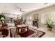 Open-concept living room with a ceiling fan and an exercise bike at 12809 W Evans Dr, El Mirage, AZ 85335