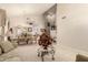 Living room with an open floor plan featuring a dining area and a fireplace at 12809 W Evans Dr, El Mirage, AZ 85335